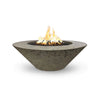 The Outdoor Plus 48" Cazo Wide Ledge Concrete Gas Fire Pit in moss stone finish, evoking a natural and earthy aesthetic. The textured surface brings a rustic yet organic feel to outdoor spaces, perfect for natural landscapes or garden settings. The wide ledge adds versatility for decor or seating.