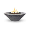 The Outdoor Plus 48" Cazo Wide Ledge Concrete Gas Fire Pit in a rustic gray finish with a natural textured surface. This fire pit is designed to bring an elegant, weathered look to outdoor patios, combining durability with style. Its wide ledge adds functionality for decorative or seating purposes, making it a perfect centerpiece for any outdoor living space. 