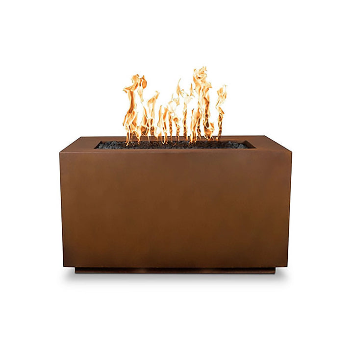 The Outdoor Plus 48-inch Pismo Steel Gas Fire Pit in a corten steel finish. This rectangular fire pit showcases a naturally weathered look that blends seamlessly into rustic and contemporary outdoor settings. Built from high-quality corten steel, this fire pit is designed to withstand harsh weather conditions, developing a protective patina over time that enhances its aesthetic appeal. An ideal choice for nature-inspired or industrial-style decor.