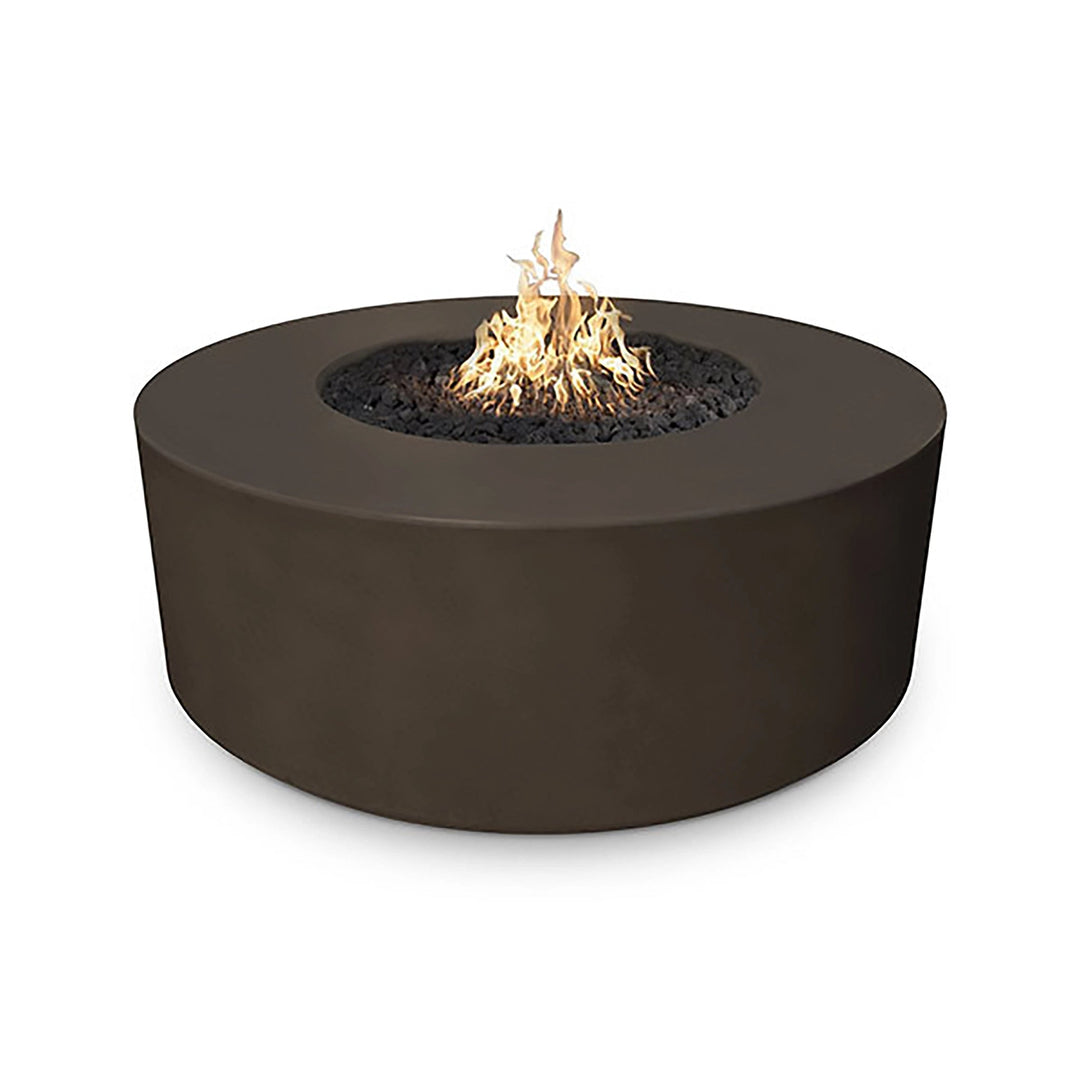 The Outdoor Plus 54-inch Occasional Height Florence Concrete Gas Fire Pit in a deep chocolate color, featuring a rich, dark brown finish that adds warmth and depth to any outdoor area. This elegant fire pit combines contemporary design with rugged durability, making it a standout piece for patio or backyard gatherings. The smooth round structure houses a vibrant central flame surrounded by black lava rock.