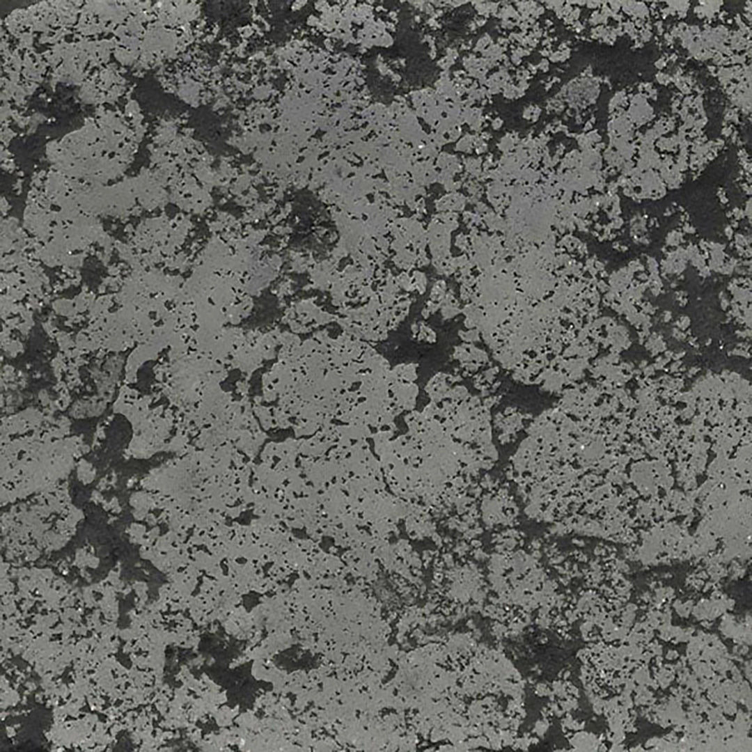 The Outdoor Plus 72-inch Del Mar Concrete Gas Fire Pit swatch in rustic gray, showcasing a speckled dark gray pattern that brings a rugged charm to outdoor settings. Ideal for creating a rustic, natural look in backyards and patios.