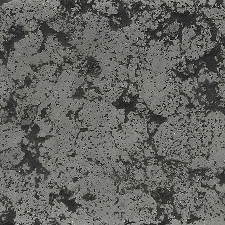 The Outdoor Plus 72-inch Del Mar Concrete Gas Fire Pit swatch in rustic gray, showcasing a speckled dark gray pattern that brings a rugged charm to outdoor settings. Ideal for creating a rustic, natural look in backyards and patios.
