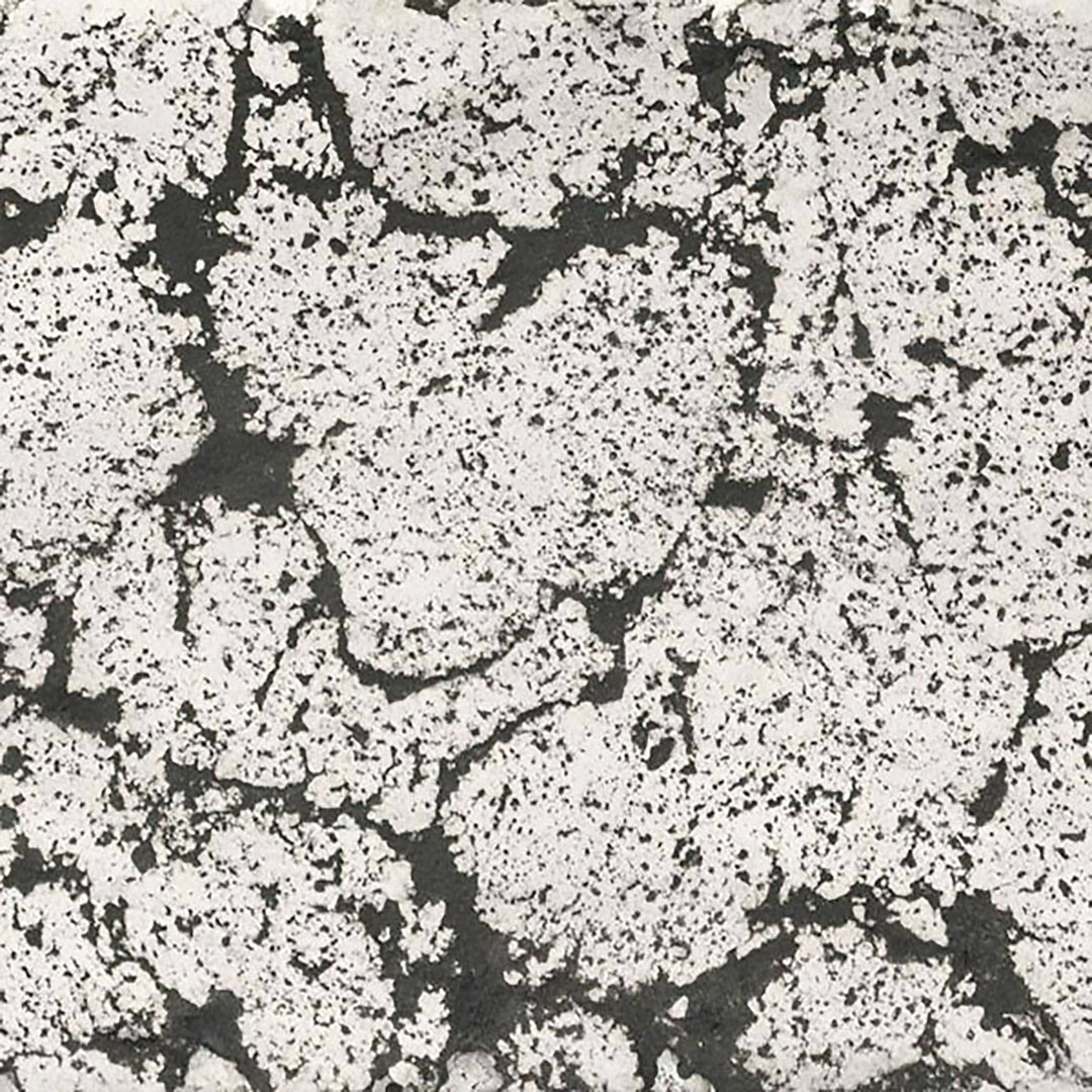 A swatch of The Outdoor Plus 84" Del Mar Concrete Gas Fire Pit in Rustic White, displaying a weathered, textured look in a soft off-white tone. Adds character to any classic or farmhouse-inspired outdoor space. 