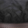 Close-up view of the fabric texture of The Outdoor Plus round bowl fire pit cover, highlighting the high-quality, tear-resistant black material that offers reliable protection against harsh weather conditions. The fabric's durable weave and waterproof properties make it ideal for preserving the finish of your fire pit. Perfect for preventing moisture and dust build-up.