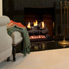 Vent-Free Designer Gas Logs Golden Oak by Real Fyre in a cozy lifestyle setup. Vibrant flames enhance the living room's warmth and ambiance