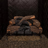 24-inch Real Fyre Vented Charred Oak Gas Logs stacked in a fireplace grate, ready for use without fire. The charred oak finish and realistic wood details provide a natural aesthetic even without flames, perfect for adding rustic charm to any vented gas fireplace.