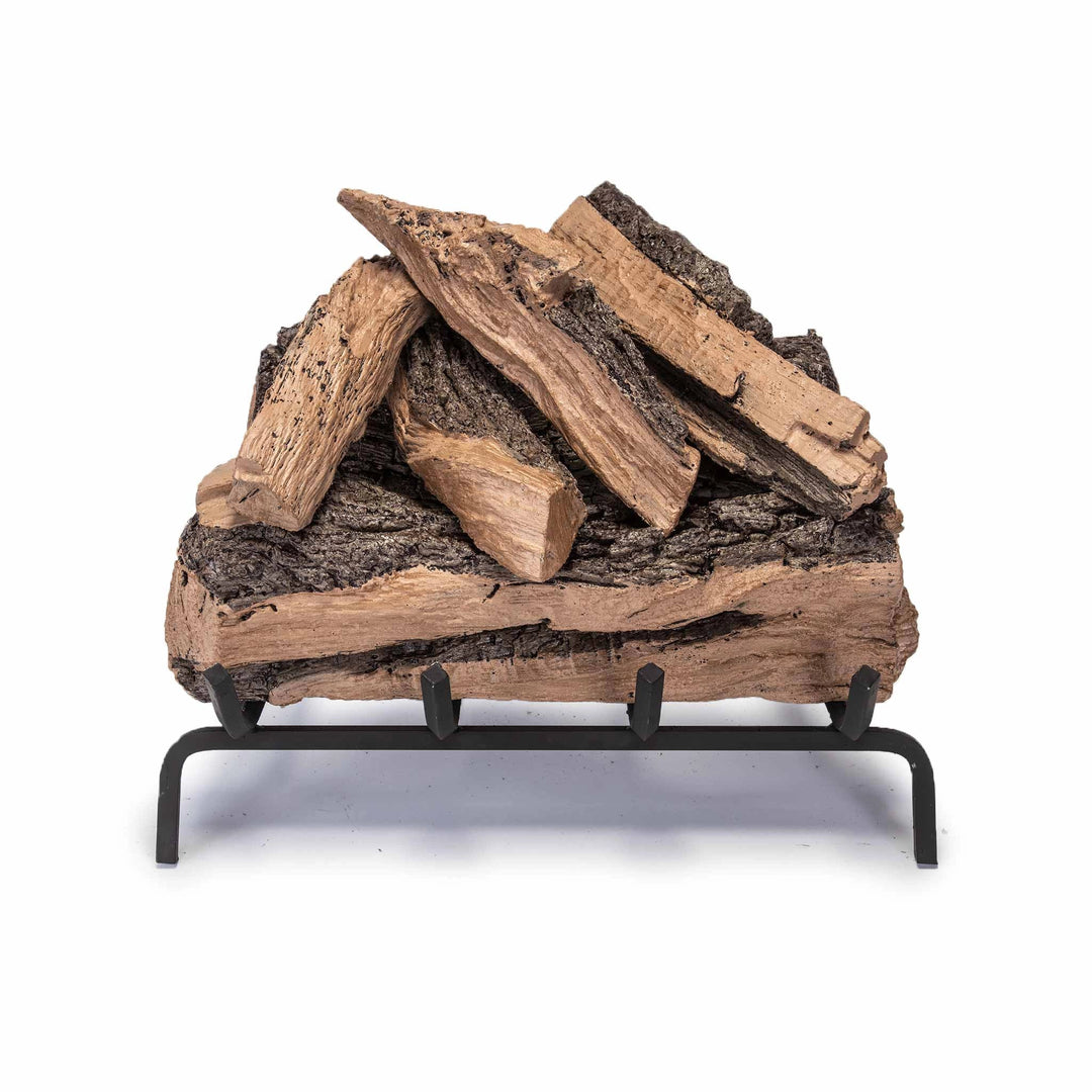 The Real Fyre Vented Designer Plus Gas Logs in Split Oak, 18 inches, arranged on a black metal grate. This gas log set features highly realistic bark and split wood textures, creating a natural look for vented gas fireplaces. Ideal for enhancing the ambiance of a traditional fireplace, this set adds warmth and a classic charm.