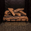 Side view of the Real Fyre Vented Designer Plus Gas Logs in split oak, unlit, showcasing the detailed bark texture and stacked log design on a black metal grate. The 24-inch log set offers a blend of large and small split oak logs, creating a natural and dynamic display for gas fireplaces. Suitable for vented setups, this set brings warmth and authenticity to indoor hearths.