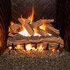 Real Fyre Vented Designer Plus Gas Logs in split oak, 30 inches, with flames lit in a fireplace, creating a radiant and natural fire scene. The large log set features a realistic split oak design with detailed bark texture, replicating a traditional wood fire. Ideal for larger vented gas fireplaces, it provides a high-end solution for homes seeking the warmth and aesthetic of real oak logs.