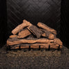 Unlit front view of the Real Fyre Vented Designer Plus Gas Logs in split oak, 30 inches, stacked in a natural formation on a black fireplace grate. This large log set captures the rugged appearance of split oak wood, with intricate bark and exposed wood detailing, offering a lifelike look for gas fireplaces. Ideal for larger fireplaces, it enhances the cozy atmosphere of any living space.