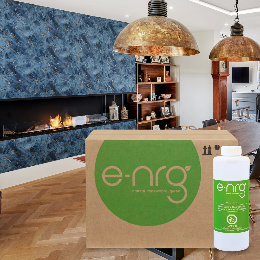 Contemporary living room featuring a blue marble-patterned modern fireplace, with e-NRG bioethanol fuel box and bottle in the foreground, highlighting the use of clean-burning, eco-friendly fuel. The space is decorated with brass pendant lights and wooden shelves displaying various decor item