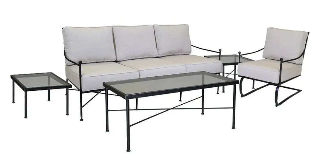 Minimalist outdoor furniture set with a metal frame sofa and chair, beige cushions, and glass-topped coffee and side tables